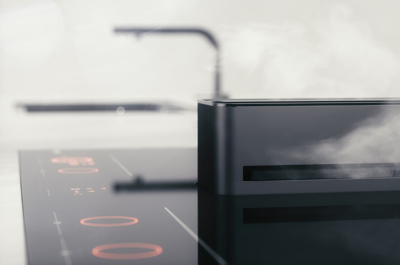 Modern kitchen with an induction cooktop and minimalist design.