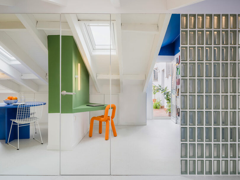 Bright and colorful attic space with modern design and skylight.